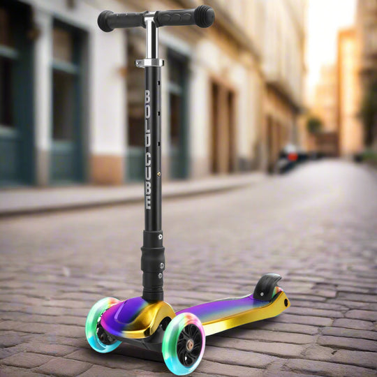 Children's three wheeled scooter with black handles and black vertical bar with 'Bold Cube' written down in, and a colourful oil-like rainbow pattern on the tread with rainbow light-up wheels