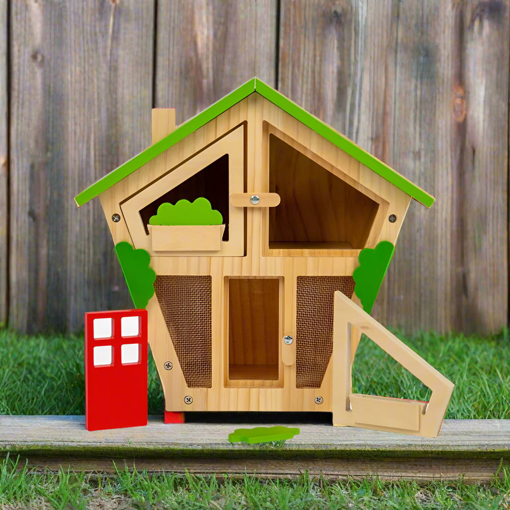 Shows wooden bug house with certain parts removed showing that it has internal compartments