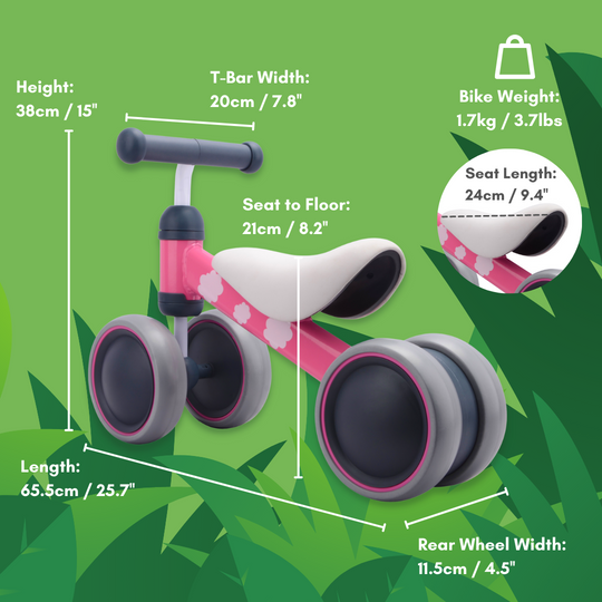 Children's balance bike with measurements on a green leafy background