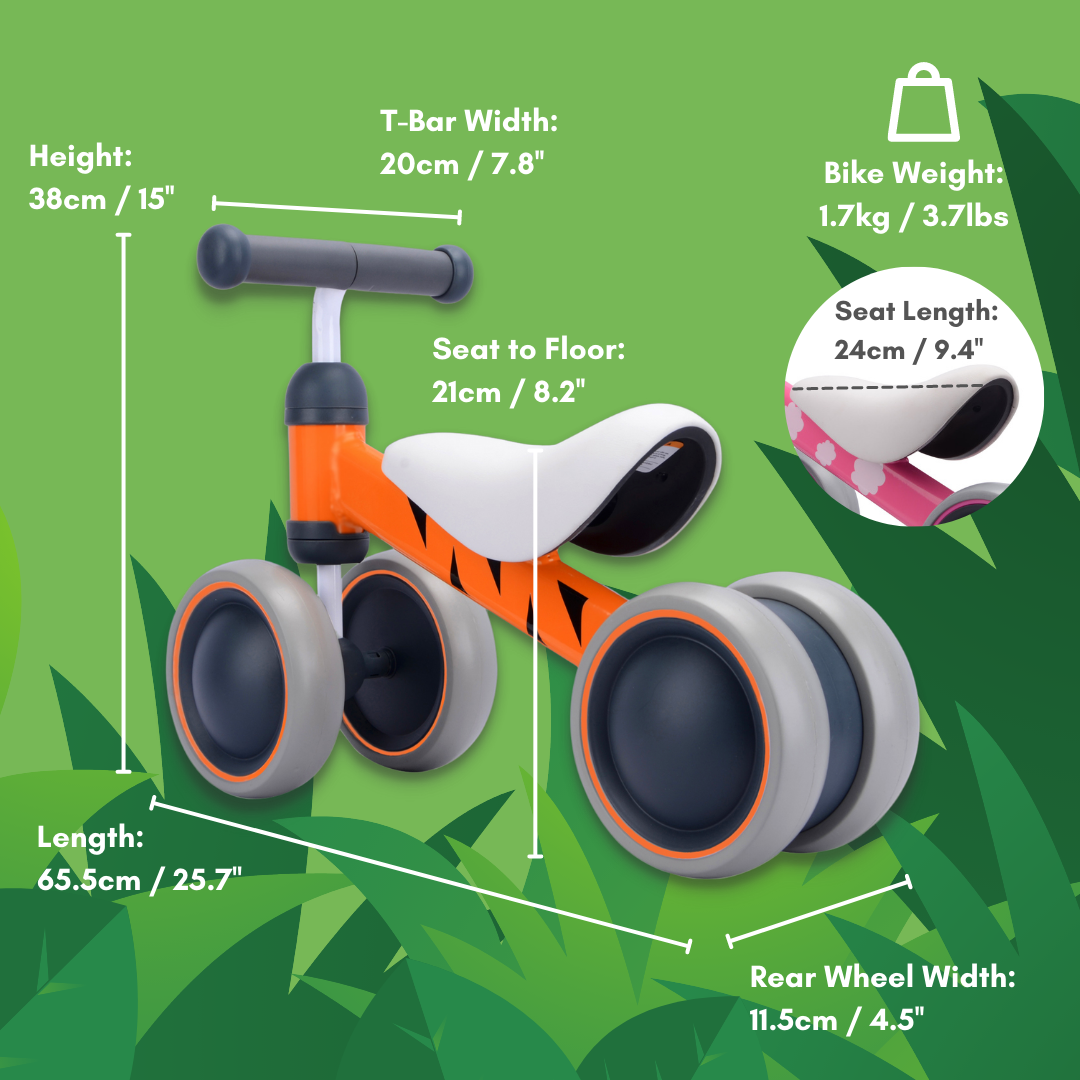 Children's balance bike with measurements on a green leafy background