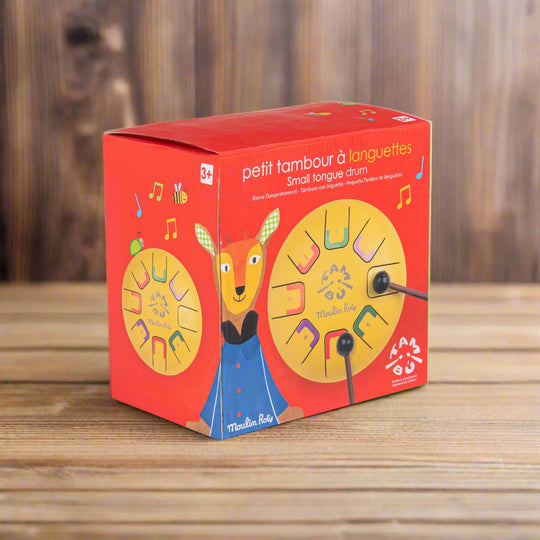 Red packaging box with a colourful drum design and cartoon character on a white background