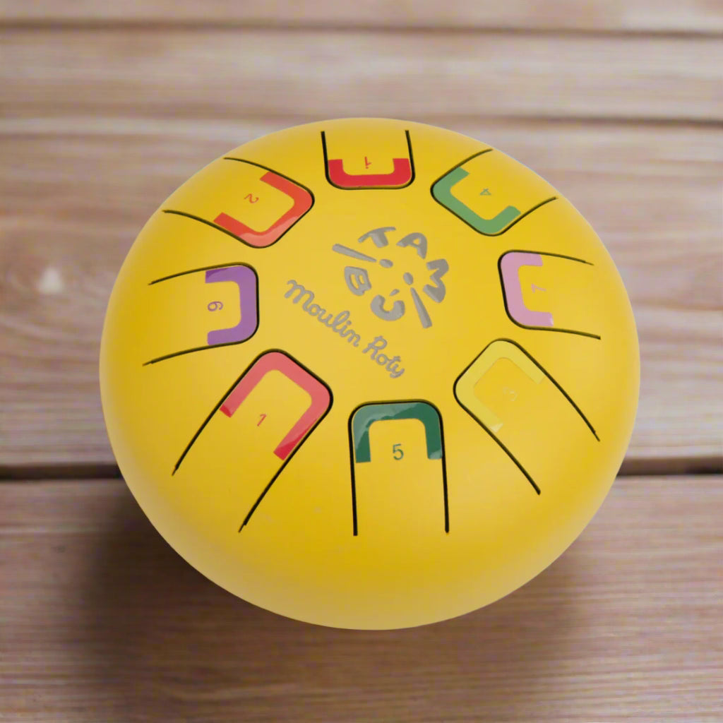 Yellow metal musical instrument with colourful notes