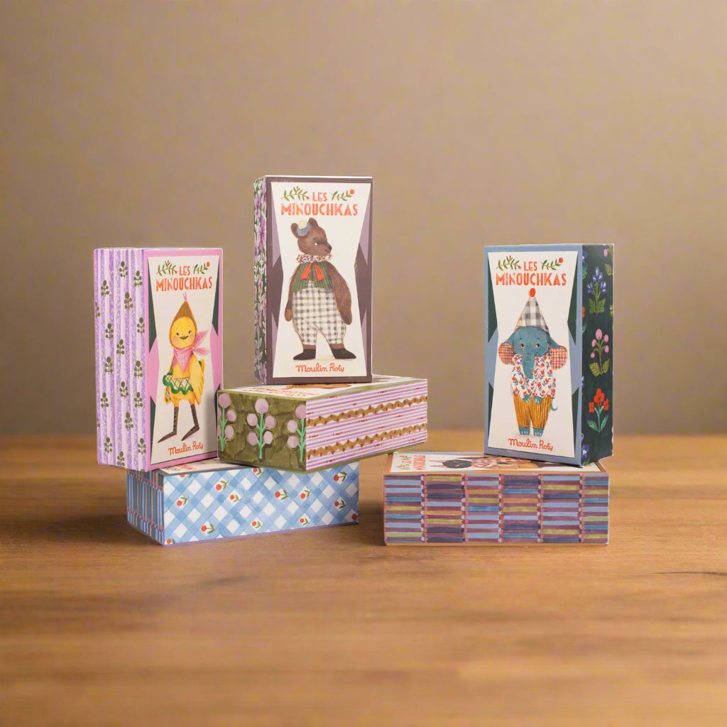 Set of colourful boxes with cartoon characters, showing the other characters in the range