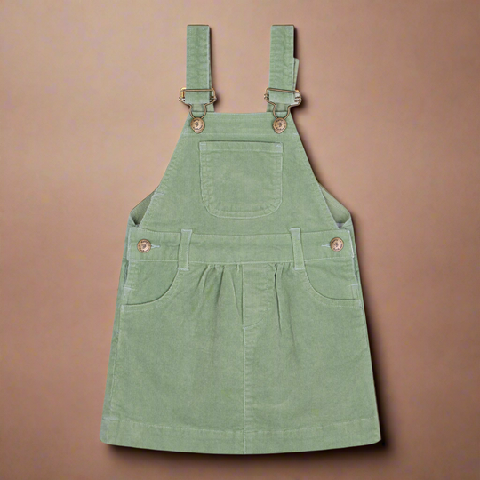 Sage green coloured corduroy dress with two pockets on the side and one central chest pocket with brass buttons