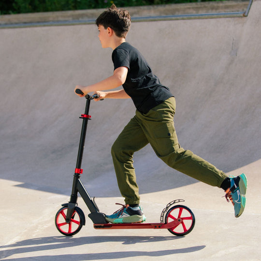 Person riding a scooter at a skate park
