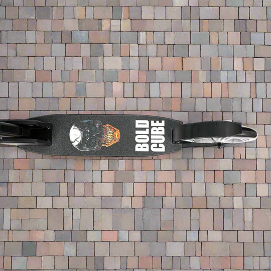 Close-up of the tread of the scooter with a skull design and 'Bold Cube' brand written on it