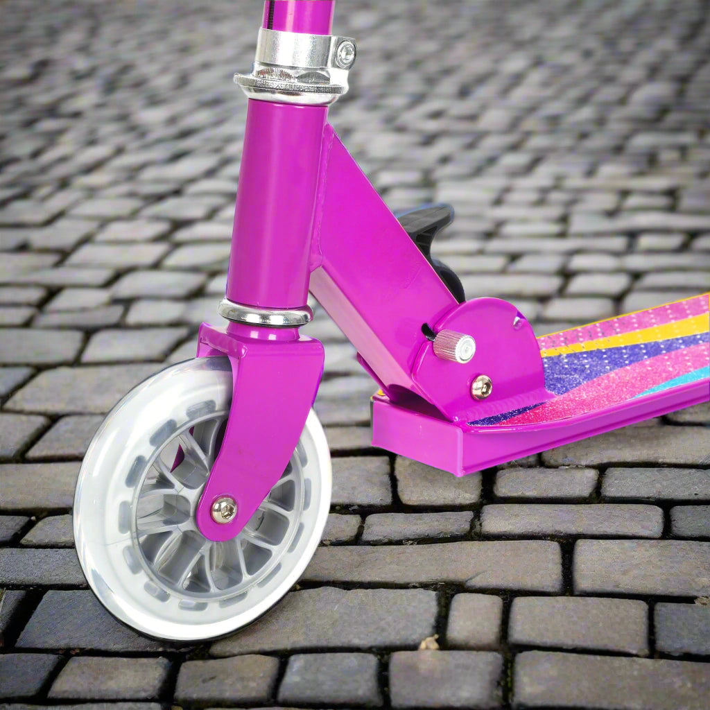 Close up of front wheel which is transparent on cobbled pavement background