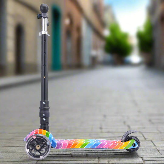 Children's scooter with rainbow-coloured deck and handlebar from the side