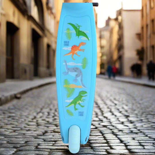 Close up of blue scooter with dinosaur illustrations