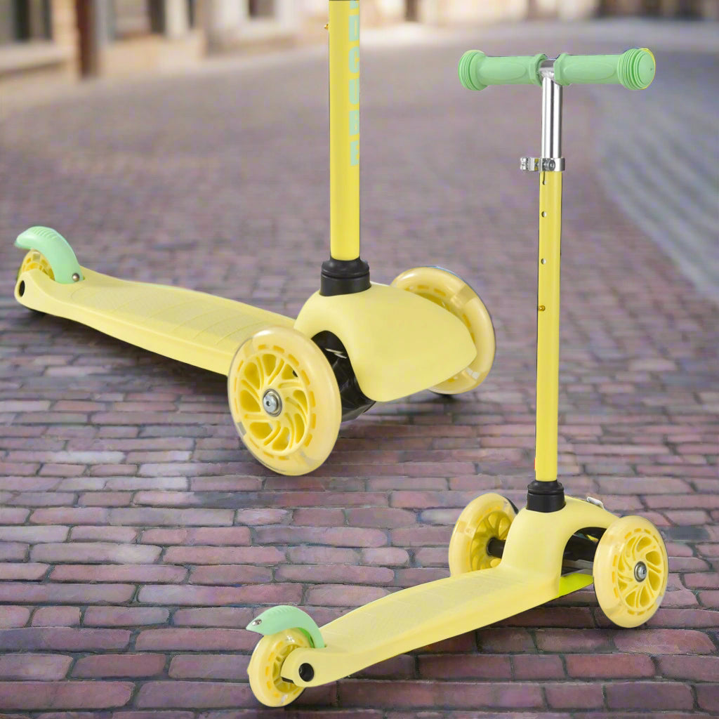 Yellow scooter with yellow wheels and green handlebars on cobbled street of a city