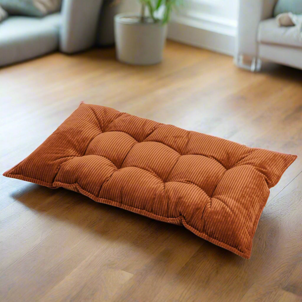 Terracotta brown coloured floor cushion with chunky ribbed corduroy fabric and buttons