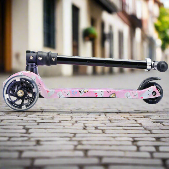 Pink scooter with black wheels folded into a portable size