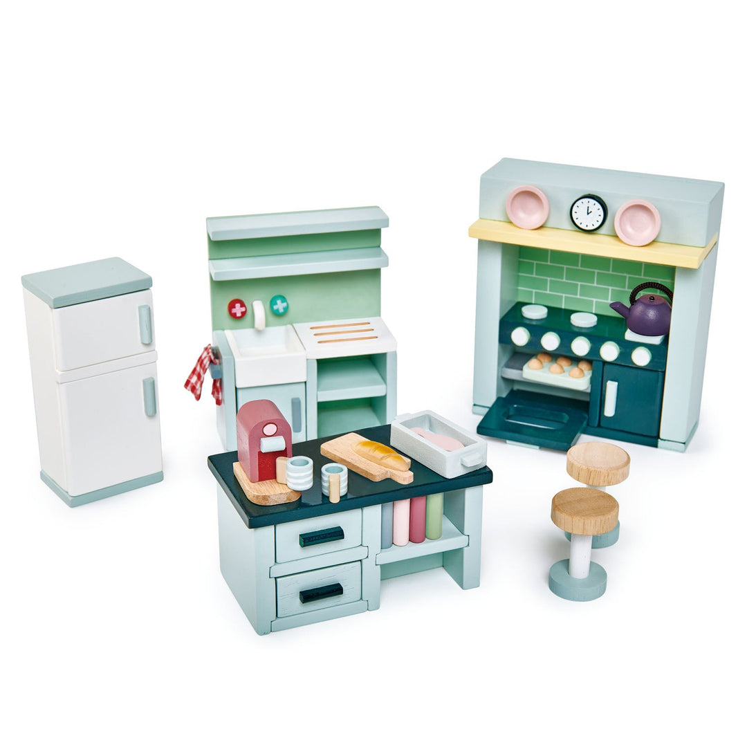 Set of toy kitchen furniture and accessories on a white background