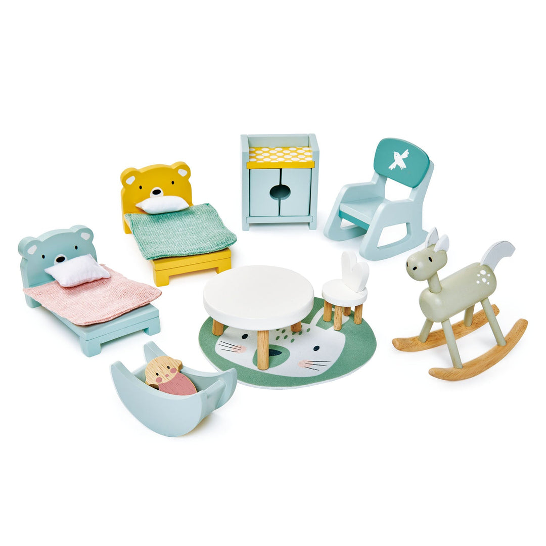 Set of children's playroom furniture including wooden toys, chairs, table, and rocking deer on a white background