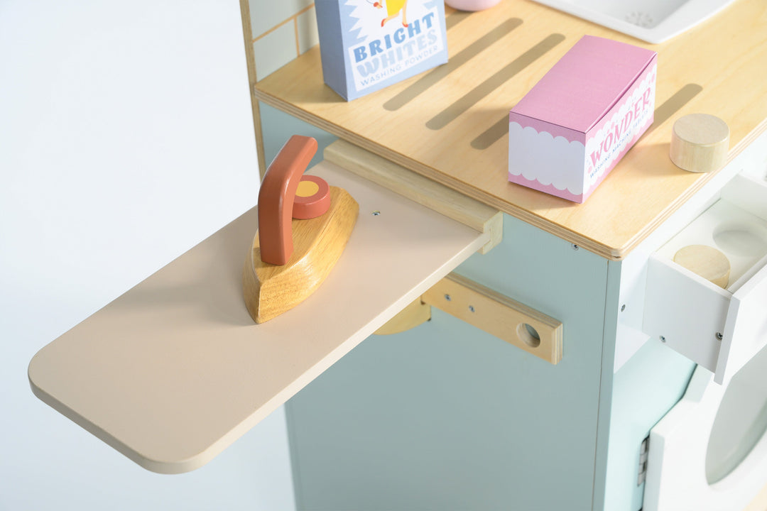 Children's play kitchen set with wooden shelves and toy items on a white background