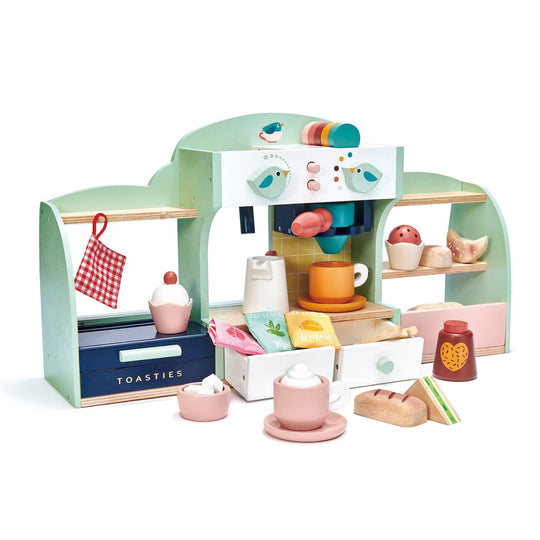 Toy cafe set with various items on a white background