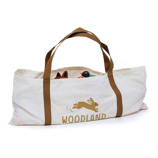 Canvas tote bag with brown handles featuring a rabbit illustration and 'Woodland' text on a white background.