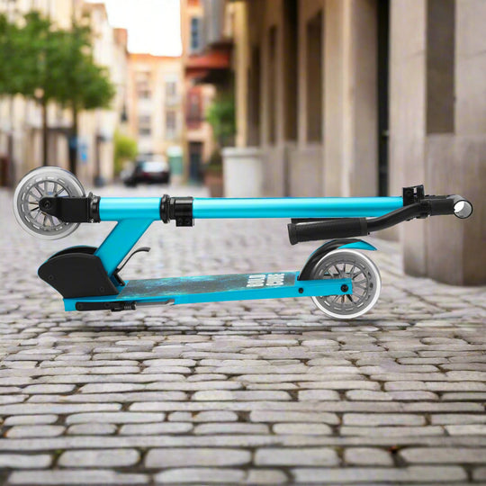 Blue scooter folded into a compact shape on a city street
