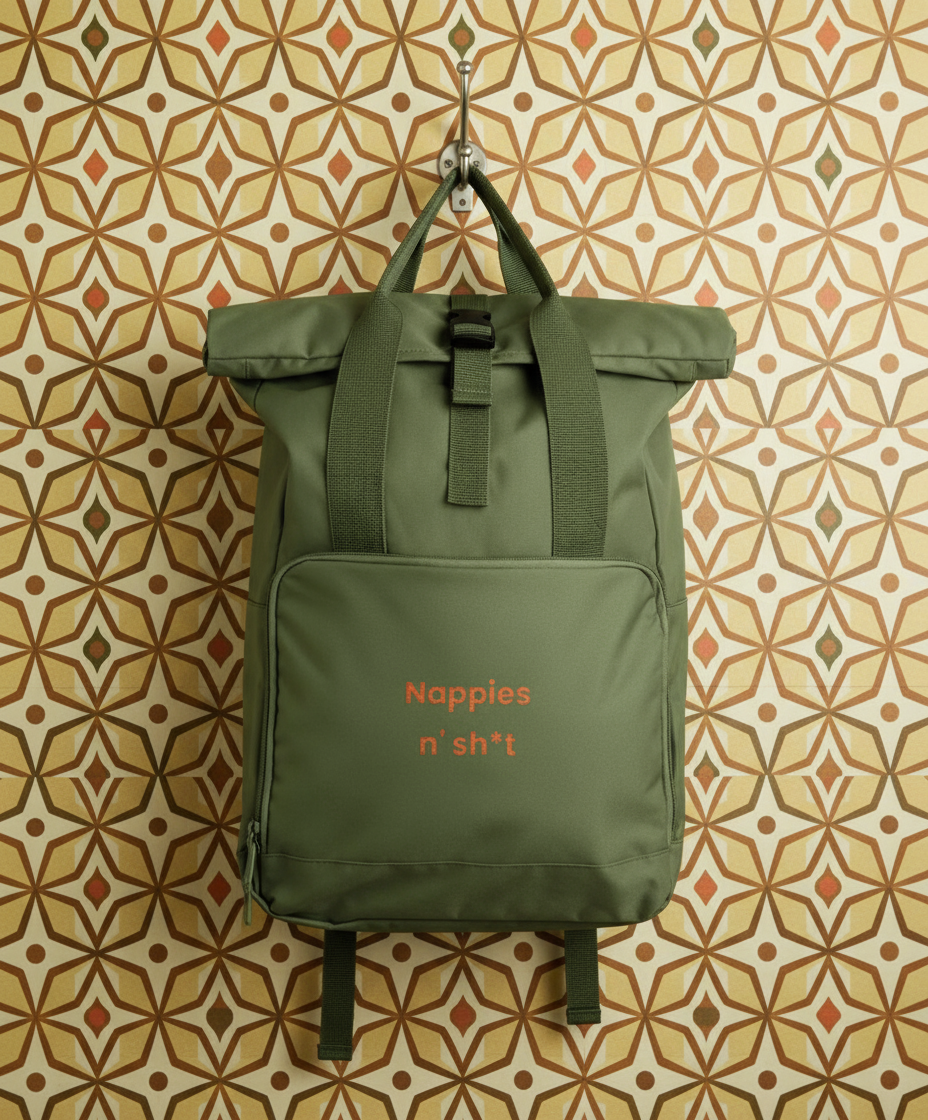 Green backpack with text on a patterned wall