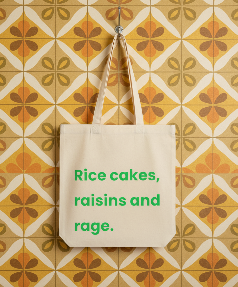 Beige tote bag with green text on a patterned wall