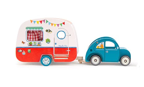 Wooden camper attached to blue car which is sold separately