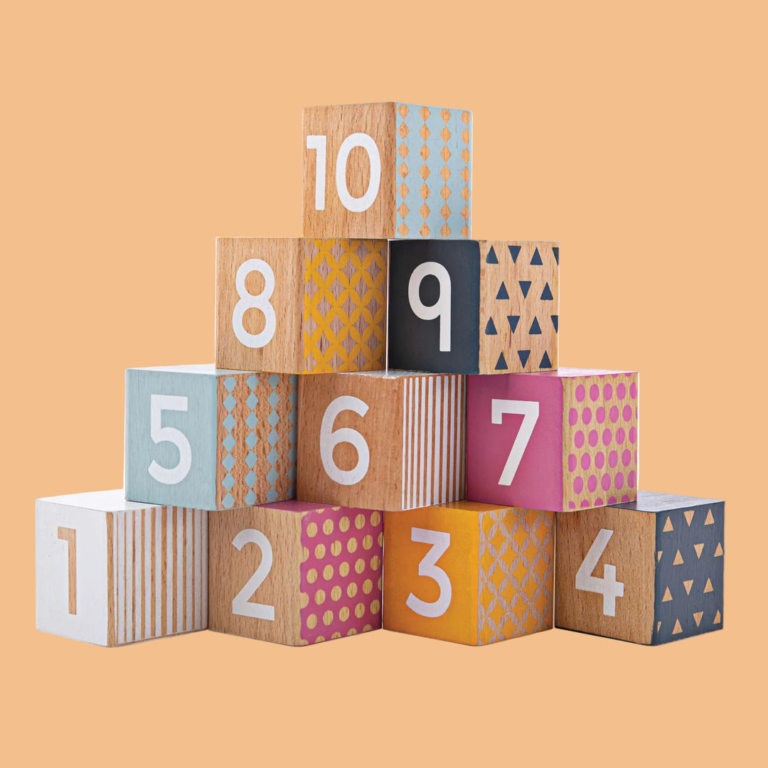 Colorful wooden blocks with numbers and patterns on a white background