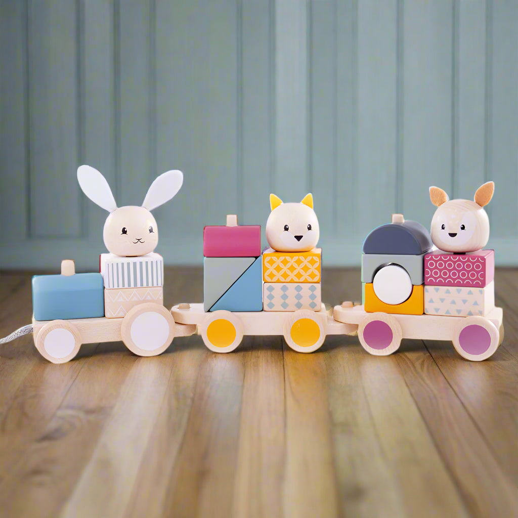 A colourful wooden pull-along toy train with one engine, two carriages, and three animal passenger figures, including a rabbit and a bear, all designed to be removed and stacked