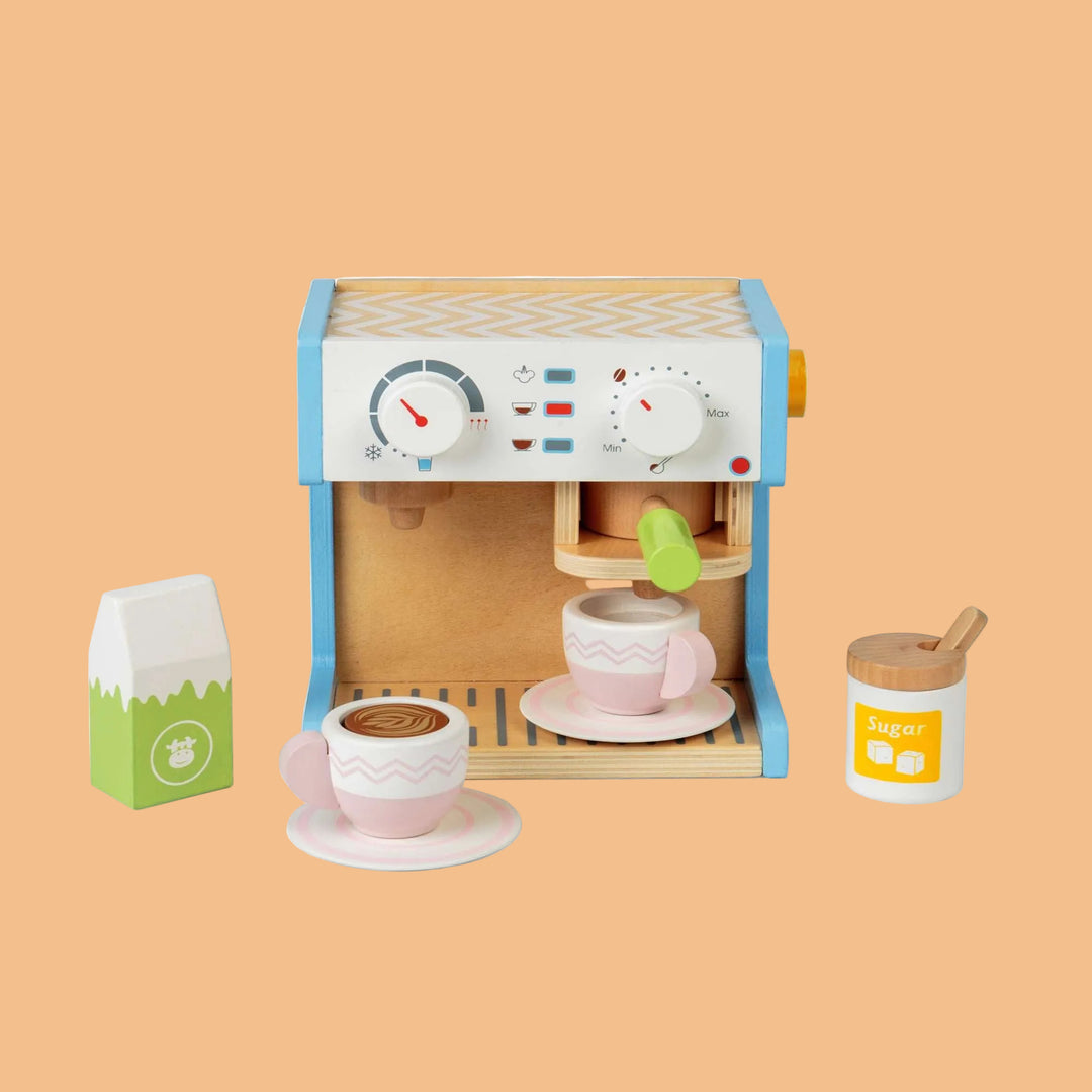 Wooden toy coffee maker set with cups and milk carton on a white background