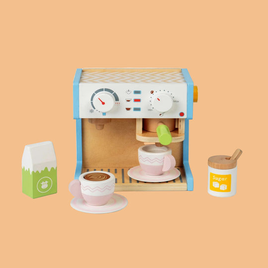 Wooden toy coffee maker set with cups and milk carton on a white background