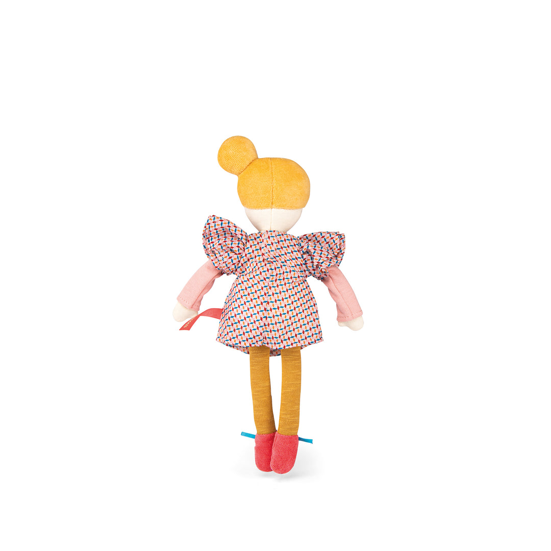 Doll facing away showing the back of her purple patterned dress