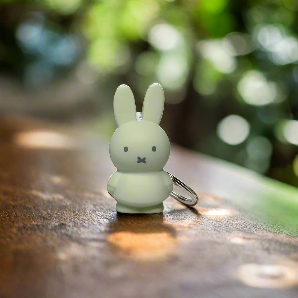 Pale green coloured bunny character keyring with iconic cross stitched mouth
