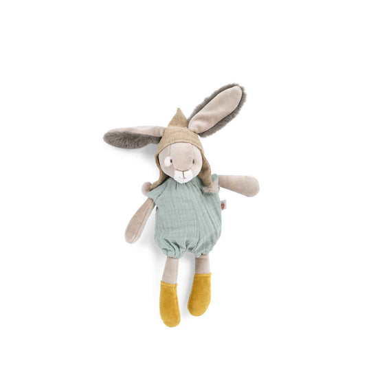 Stuffed rabbit eith fluffy ears sticking out of hat with bobbles. It is wearing a pale turquoise romper and has mustard yellow shoes