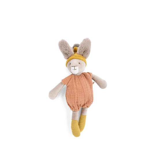 Stuffed toy rabit wearing a peach coloured romper with a mustard yellow hat with fluffy ears coming out upright from the hat