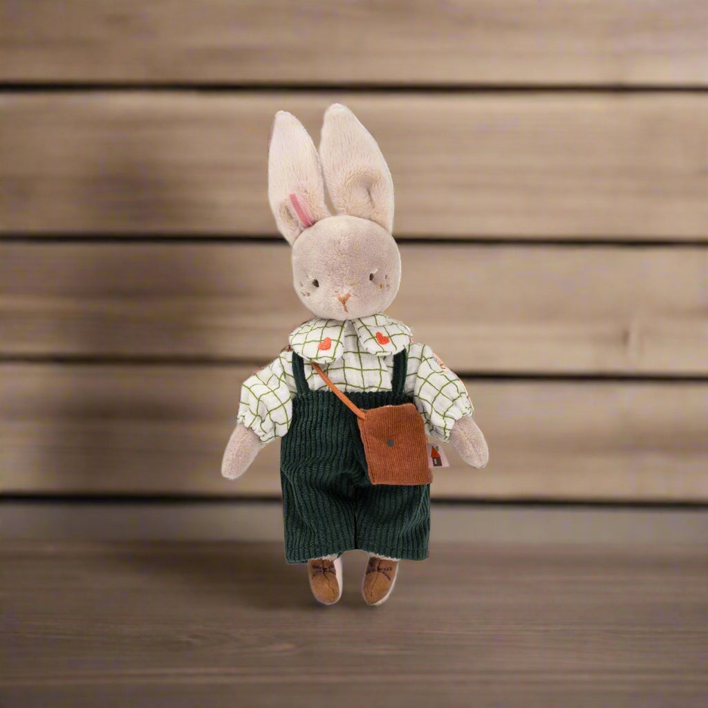 Stuffed toy rabbit wearing navy dungarees and a white checked shirt with a satchel bag