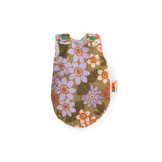 Retro 70s-style floral patterned sleepsack with embroidered turquoise circles on shoulder fastenings