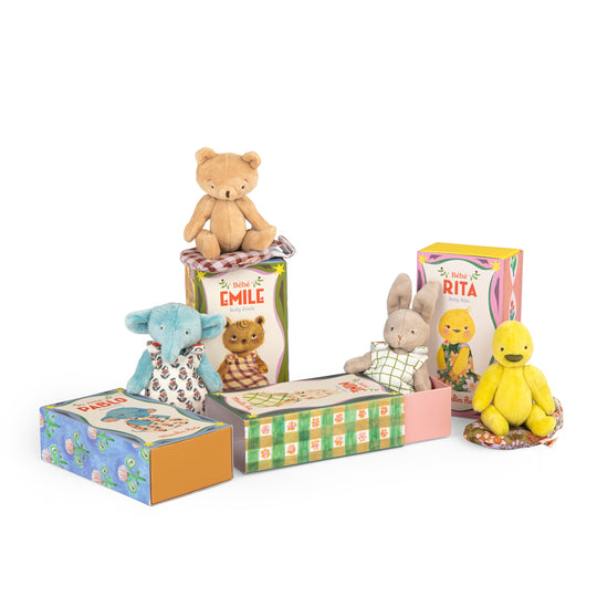 Collection of small stuffed animals in colourful boxes on a white background