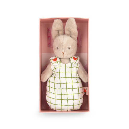 Stuffed rabbit toy wearing checked sleepsack in the packaging box