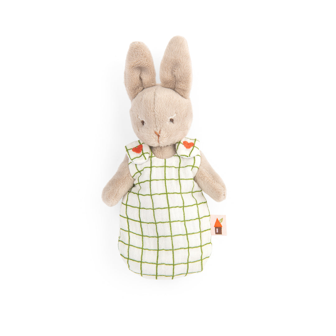 Stuffed rabbit toy wearing a white sleepsack with green checkered pattern and embroidered red hearts on the shoulders