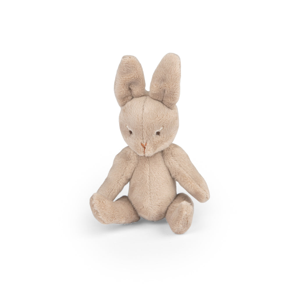 Stuffed rabbit toy sitting down without the sleepsack on