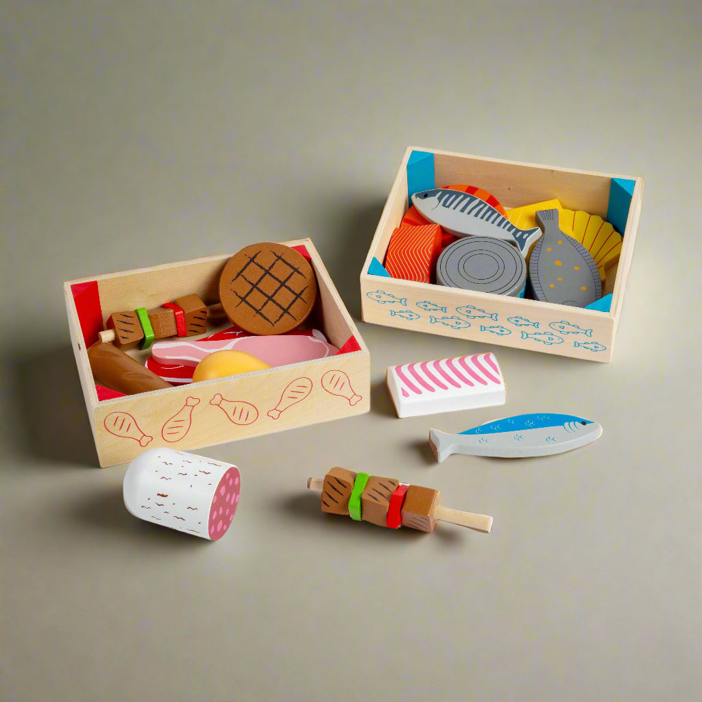 Wooden toy food set with boxes on a white background