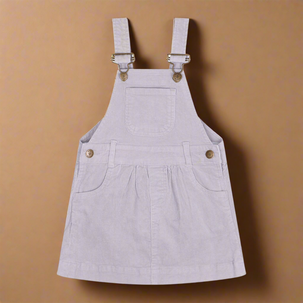 Light grey corduroy dress with two pockets each side and a central pocket on the chest and bress buttons