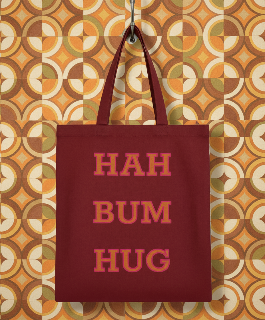 Red tote bag with 'HAH BUM HUG' text on a white background