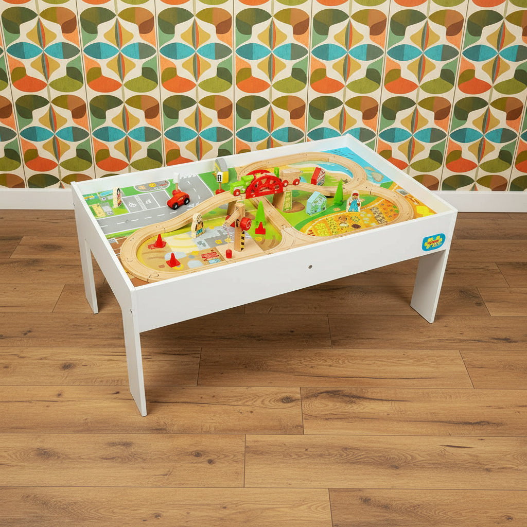 A 50-piece wooden train set and table with various play features, including a shipping crane, houses, trees, traffic signals, people, and a miniature car for the roadway section. The set appears colorful and is designed for children.