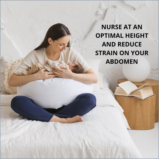 Woman holding a baby with a pillow under her back, text about nursing at an optimal height reducing strain on abdomen