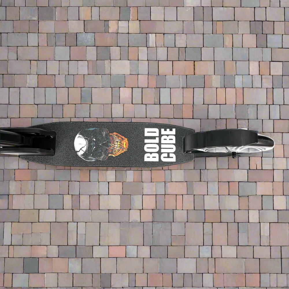 Close-up of the tread of the scooter with a skull design and 'Bold Cube' brand written on it