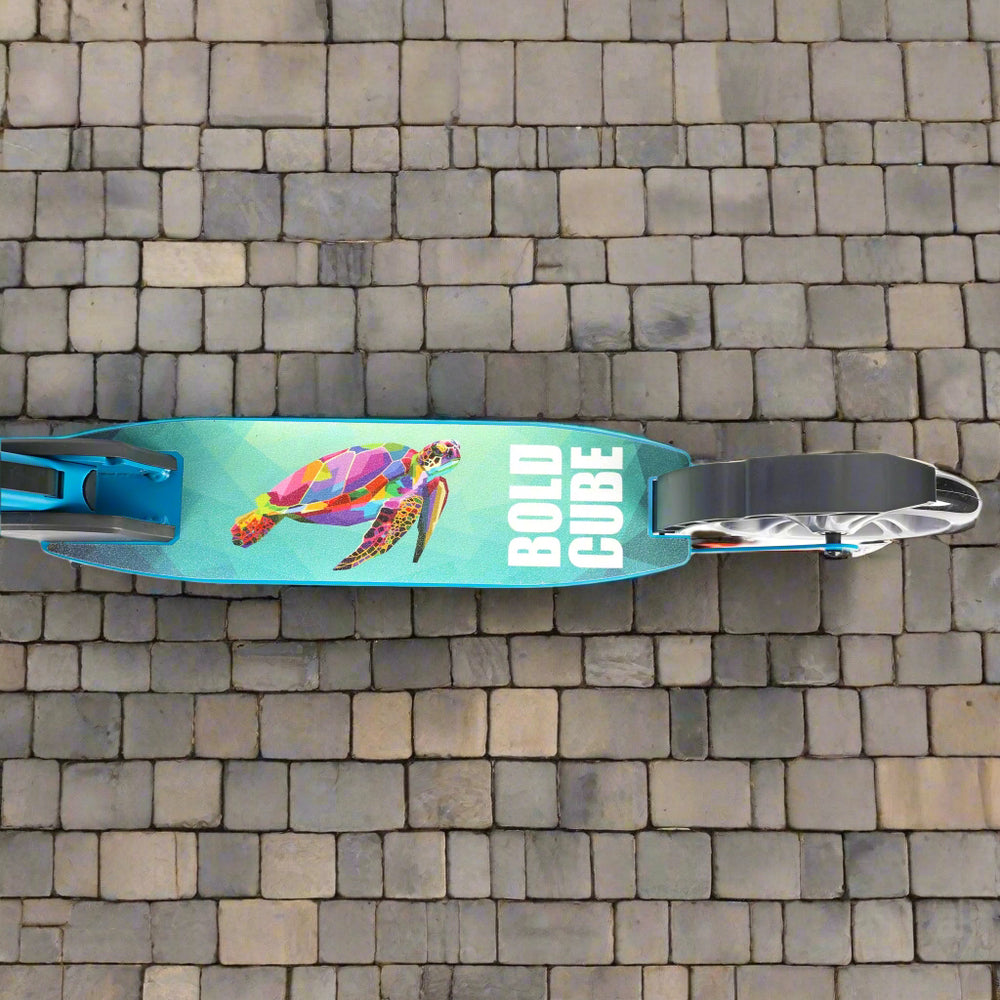 Close up of the tread of the scooter shhowing a colourful turle swimming on a blue background and 'Bold Cube' written next to it