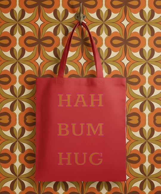 Red tote bag with 'HAH BUM HUG' text on a white background