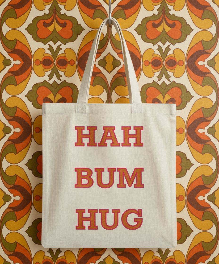 Beige tote bag with red text 'HAH BUM HUG' on a white background