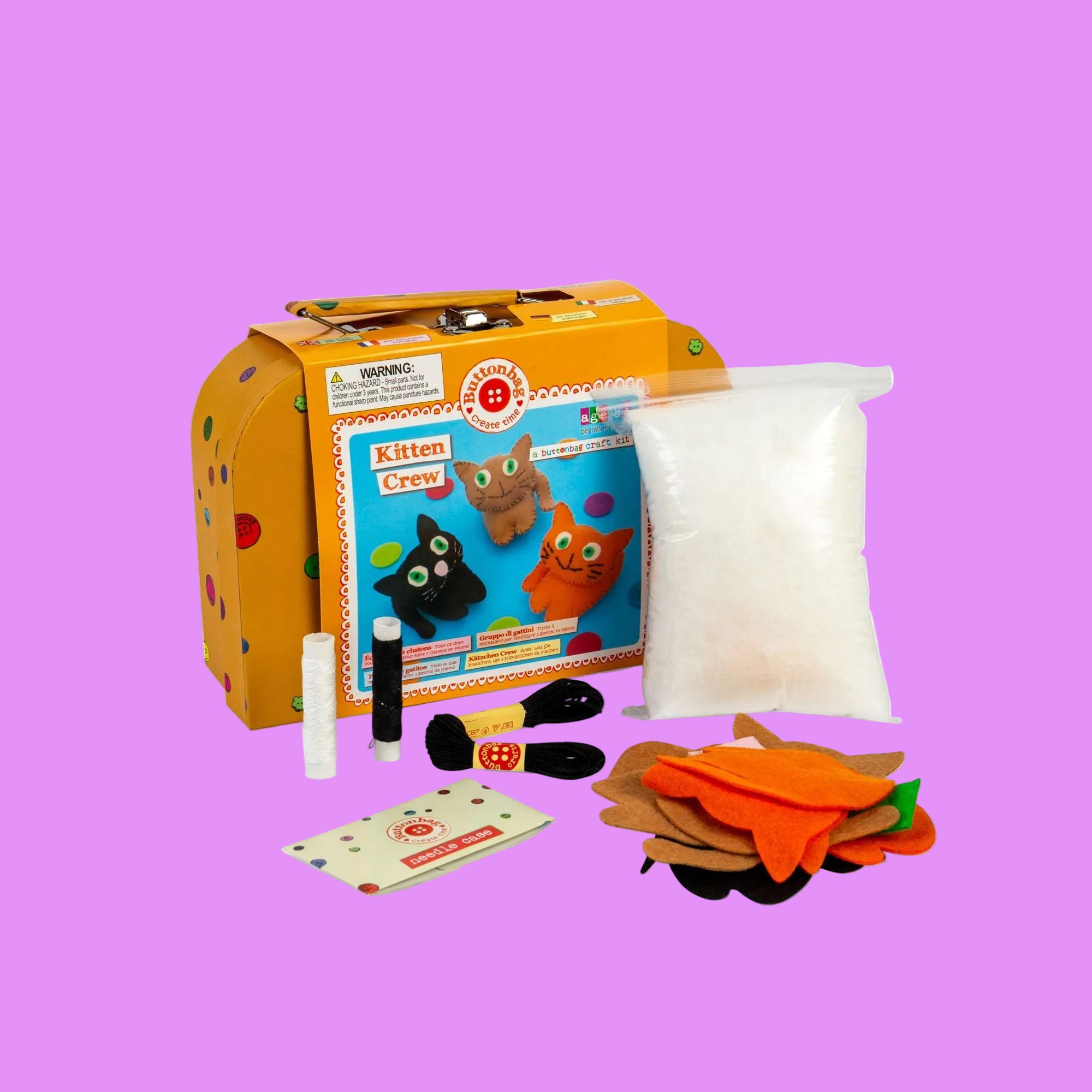 Children's toy set with a colorful box featuring cartoon cats, including toys and materials on a white background.