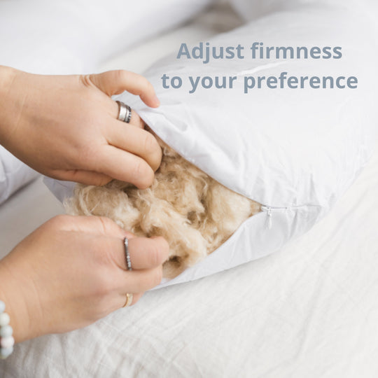 Person adjusting a pillow with visible fibers, text 'Adjust firmness to your preference' on a white background.